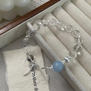S925 sterling silver beaded bracelet with aquamarine and a delicate silver bow pendant