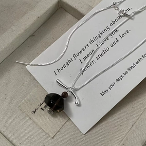 Detailed view of S925 silver necklace featuring smoky quartz pendant and retro wooden bead
