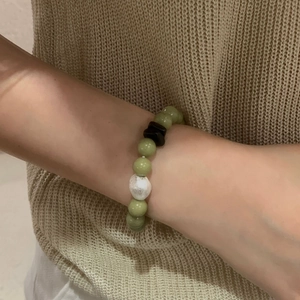 S925 Sterling Silver Beaded Bracelet with Green Jade and White Texture Beads on wrist