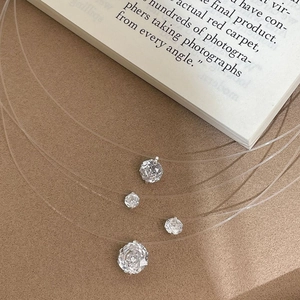 Elegant set of four S925 silver invisible fish line necklaces with clear round zircons