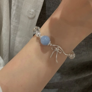 Elegant S925 silver bracelet featuring blue aquamarine, clear crystals and a bow charm