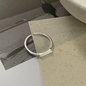 Detailed view of S925 sterling silver geometric ring with brushed matte finish texture