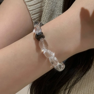 S925 sterling silver beaded bracelet with clear crystals and dark wooden beads on wrist