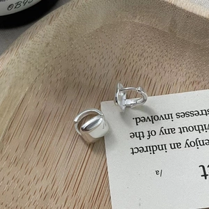 Detailed close-up of square sugar-cube charms on S925 sterling silver hoop earrings