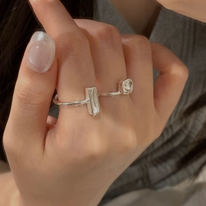 Elegant 925 sterling silver open ring with rectangular and round cubic zirconia accents