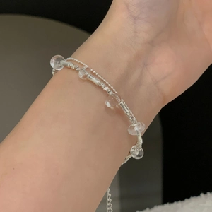 Detail of S925 sterling silver double-layer beaded bracelet with clear crystal beads