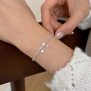 S925 sterling silver beaded bracelet featuring starfish, shell and natural pearl charms