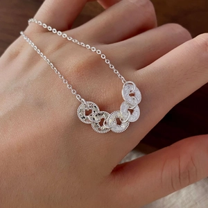 S925 sterling silver bracelet with five interlocking textured rings on a fine O-chain