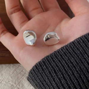Polished S925 sterling silver irregular stud earrings with a glossy organic mirror finish