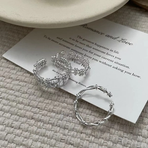 Detailed close-up of S925 sterling silver multi-layer grid and twisted open rings