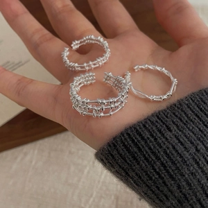 Macro shot of S925 sterling silver multi-layer grid rings with unique woven texture detail
