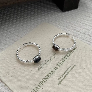 Detailed close-up showing the S925 silver hallmark and oval gemstone inlay on the rings