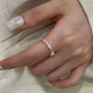 Minimalist S925 sterling silver woven grid ring layered on finger for a modern chic look