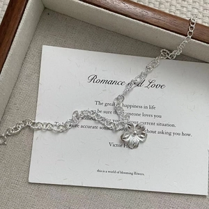 925 sterling silver handmade flower bracelet with vintage links on a soft jewelry tray