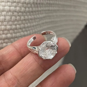 Detail of S925 sterling silver stamp and sparkling zircon on adjustable open ring