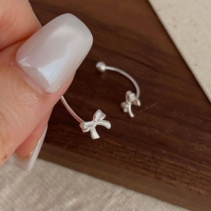 Elegant S925 sterling silver bow earrings with a unique C-shaped drop design for women