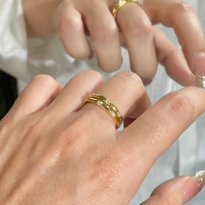 Macro view of gold plated S925 silver rings with zircon inlay and mirror reflection