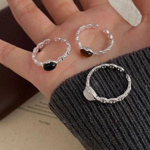 Detail of S925 sterling silver pig nose chain rings with black and white agate stones