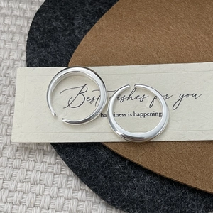 Polished S925 sterling silver open rings on textured background for a minimalist style
