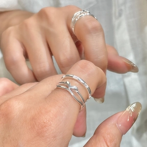 Minimalist S925 sterling silver stacked rings set with zircon stones on model's hand