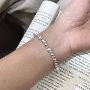 Minimalist S925 sterling silver beaded bracelet with striped texture beads on model