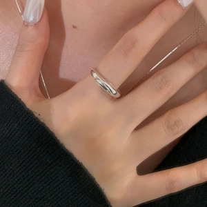 Polished S925 sterling silver dome ring worn by model with minimalist mirror finish