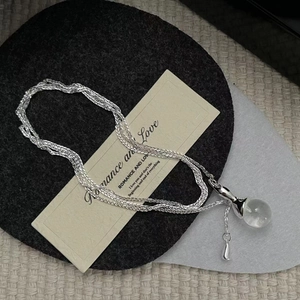 S925 Sterling Silver necklace with transparent crystal sphere pendant on a chic woven base