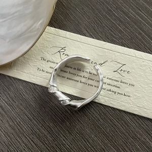 Minimalist S925 sterling silver knotted ring with irregular lava texture and matte finish