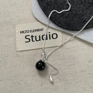 Minimalist S925 sterling silver necklace featuring a polished black obsidian sphere pendant
