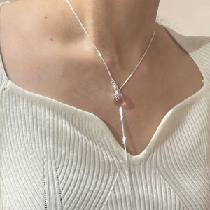 Detail of S925 sterling silver Y-shaped long necklace with round clear crystal pendant