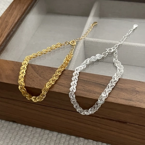 Detail of S925 sterling silver phoenix tail chain with dual-tone gold and silver finish
