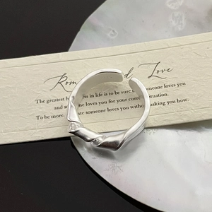 Detail shot of S925 sterling silver knotted ring with matte finish and inner hallmark
