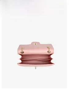 Detailed interior view of a pink quilted chain bag with double main compartments