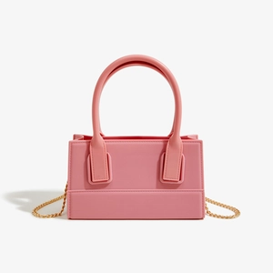Pink PVC jelly handbag with golden chain strap and double rounded top handles