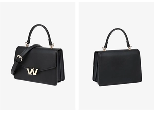 Detail view of black PU leather crossbody bag featuring gold W buckle and gusseted structure