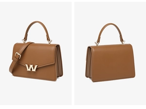 Detail view of caramel brown PU leather crossbody bag with metal W buckle and accordion sides