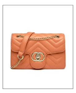 Detailed front view of coral orange quilted PU leather crossbody bag with gold chain