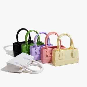 Fashionable square PVC jelly handbags for women in six vibrant colors with metal feet