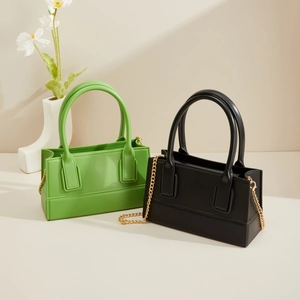 Fashionable PVC square jelly bags in green and black colors with gold chain straps