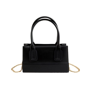 Minimalist black PVC jelly handbag with golden chain strap and round handles