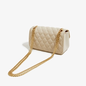 Quilted faux leather crossbody bag with gold chain strap in elegant cream white