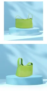 Detail view of glossy bright green PVC jelly bag with sleek handle and moon shape