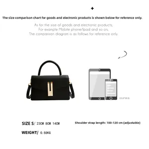 Size detail of black leather crossbody bag with adjustable strap and metal buckle