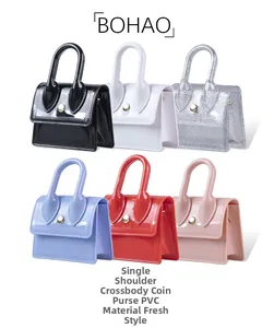 Detailed view of colorful PVC mini bags in black, silver, blue, and red with gold snaps
