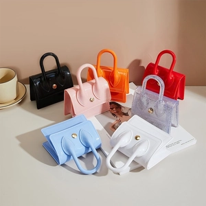 Mini PVC jelly bags with gold chain straps in seven vibrant colors for women