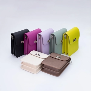 Top view of compact crossbody bags in seven colors with elegant silver metal locks