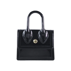 Glossy black PVC mini handbag with gold metal clasp and fishbone texture on white background