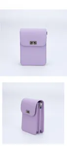 Detail view of lavender crossbody bag with silver twist lock and accordion gusset structure