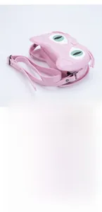 Detailed macro view of pink cat-shaped jelly bag with silicone strap and metal buckle