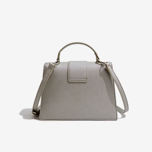 Elegant light gray cross-grain leather top handle bag with crossbody strap and metal details